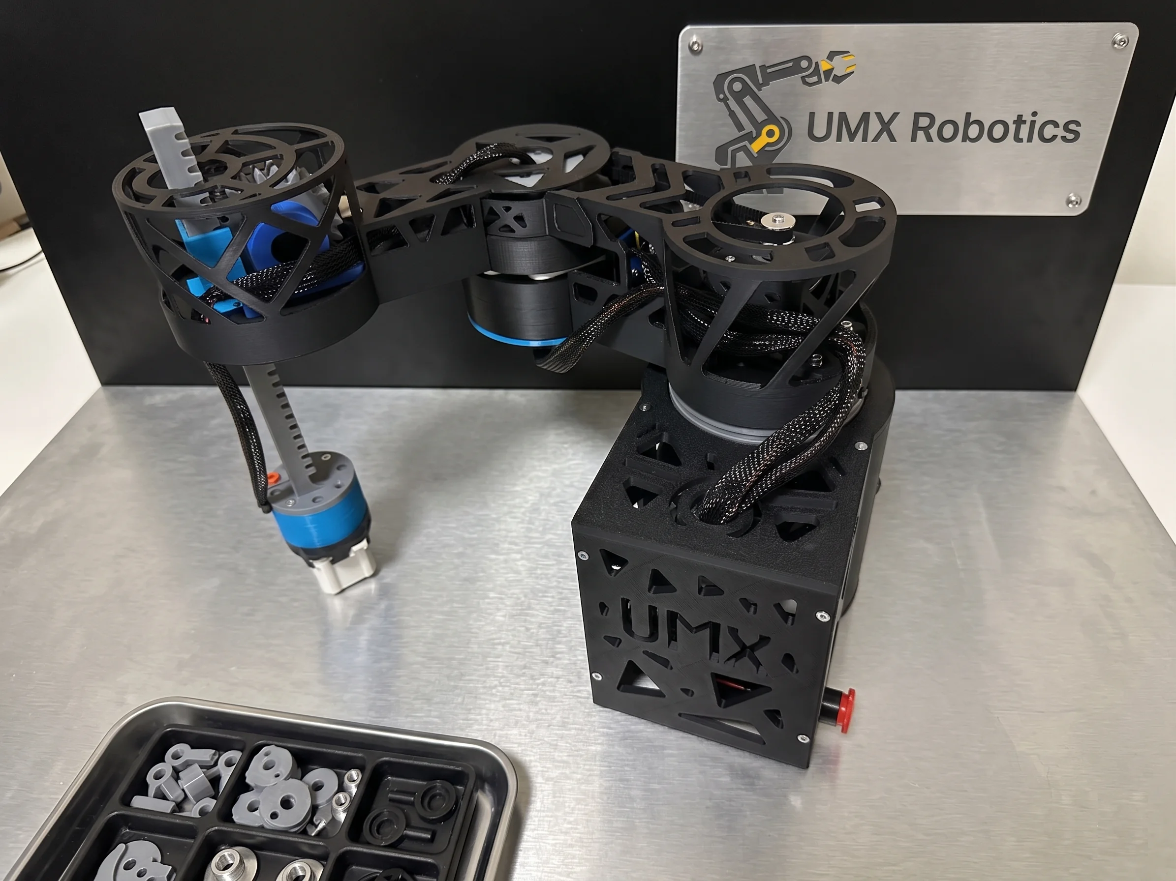 UMX Robotics educational robotic arm — side view showing the planetary gearbox, belt drive and rack-and-pinion Z-axis